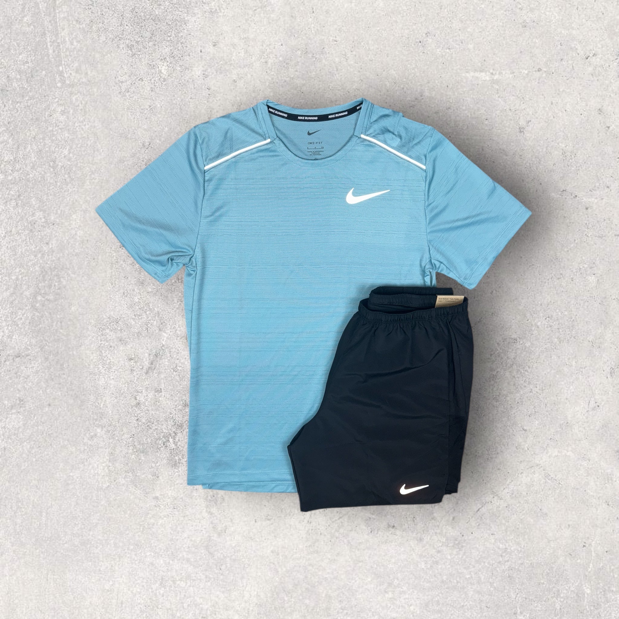 turquoise and black nike shirt